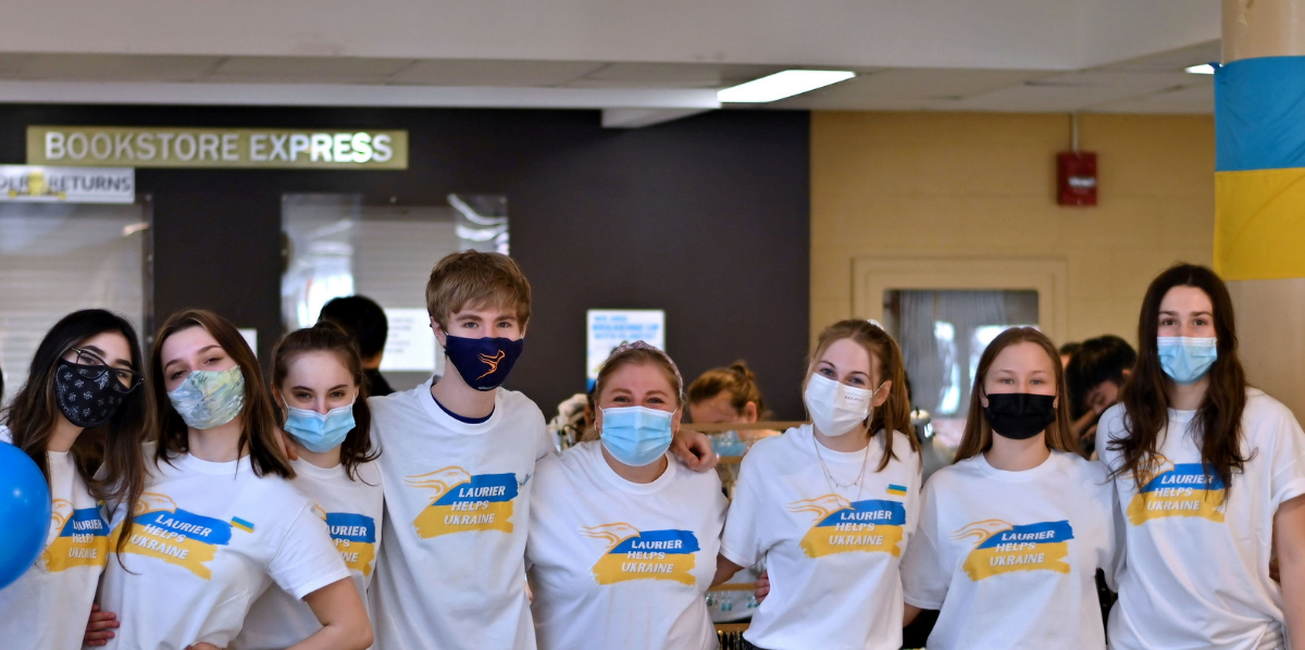 Group of students wearing Laurier Helps Ukraine t-shirts.