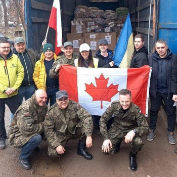 Humanitarian workers with a Canadian flag